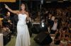 Najwa Karam recent concert picture wearing a white strapless dress in August 2009 3