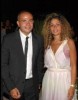 Amr Diab photo with his wife zaina wearing a formal suit and dress