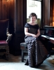 Susan Boyle picture of the recent makeover photo shoots sitting at the piano