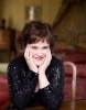 Susan Boyle picture of the recent makeover photo shoots wearing a glittery black blouse