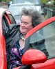 Susan Boyle candids in the Scottish village of Blackburn near her home wearing a patterened purple dress under a leather black jacket on April 21st 2009 4