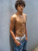 Brazilian model Marlon Teixeira weaing a loose waist denim pants