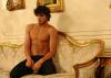 Marlon Teixeira photo shoot for Sergio K menswear campaign of fall and winter of 2009 sitting on an arm chair