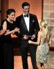 Tina Fey and actor Jon Hamm present the Outstanding Supporting Actress in a Comedy Series award onstage during the 61st Primetime Emmy Awards