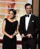 Tina Fey and actor Jon Hamm present the Outstanding Supporting Actress in a Comedy Series award onstage during the 61st Primetime Emmy Awards