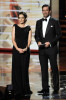 Tina Fey and actor Jon Hamm present the Outstanding Supporting Actress in a Comedy Series award onstage during the 61st Primetime Emmy Awards