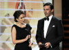 Tina Fey and actor Jon Hamm present the Outstanding Supporting Actress in a Comedy Series award onstage during the 61st Primetime Emmy Awards