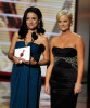 Amy Poehler and Julia Louis Dreyfus present the Outstanding Supporting Actor in a Comedy Series award onstage during the 61st Primetime Emmy Awards