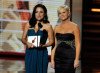 Amy Poehler and Julia Louis Dreyfus present the Outstanding Supporting Actor in a Comedy Series award onstage during the 61st Primetime Emmy Awards