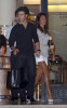 photo of Kevin Jonas with his fiance Danielle Deleasa walking together hand in hand 2