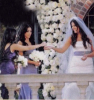 Khloe Kardashian with her bridesmaids sisters Kim and Kourtney during her  wedding