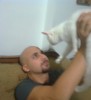 Mohamad Qwaider personal photo with his white small pet cat at his house 3