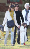 Tom Cruise and Katie Holmes with their daughter Suri at a park in Cambridge Massachusetts on October 10th 2009 10