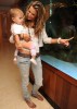 Alessandra Ambrosio spotted with her baby daughter Anja beside a fish tank in the lobby of their hotel in Miami on October 12th 2009 1