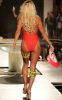 Pamela Anderson wears her red swim suit of baywatch on the runway during the Richie Rich AMUSE fashion show held at the Setai hotel in Miami Florida on October 14th 2009 4