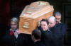 Mikey Graham, Ronan Keating, and Shane Lynch carry out the coffin of Boyzone singer Stephen Gately at St Laurence O'Toole Church on October 17th 2009 in Dublin Ireland