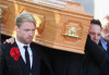 Mikey Graham and Ronan Keating carrying the coffin of Boyzone singer Stephen Gately at St Laurence O'Toole Church on October 17th 2009 in Dublin Ireland