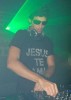 DJ Jesus Luz picture wearing a black tshirt with Jesus Te Ama imprinted on it while playing his music on stage on October 17th 2009 2