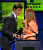 Nicholas Hoult presents the Supporting Actress award to Julianne Moore onstage during the 13th annual Hollywood Awards Gala Ceremony held at The Beverly Hilton Hotel on October 26th 2009 2