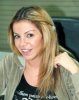 Razan Moghrabi picture with no makeup at her office in the MBC TV channel 1