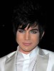 Adam Lambert arrives at the Art of Elysiums 3rd Annual Black Tie Heaven Charity Gala on January 16th 2010 in Beverly Hills wearing a stylish white suit