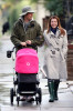 Alyson Hannigan and husband Alexis Denisof spotted together on January 19th 2010 walking with their baby daughter under the rain 6