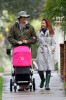 Alyson Hannigan and husband Alexis Denisof spotted together on January 19th 2010 walking with their baby daughter under the rain 2