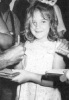 picture of Drew Barrymore when she was a little girl signing autographs since an early age