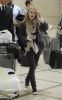 Dakota Fanning spotted on January 25th 2010 arriving at LAX Airport in California 1