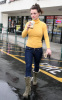 Britney Spears spotted heading to Starbucks in Calabasas California on January 26th 2010 wearing a yellow high neck top 6