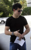 Taylor Lautner spotted walking the streets on January 9th 2010 wearing a black tshirt and sunglasses 5