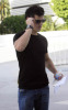 Taylor Lautner spotted walking the streets on January 9th 2010 wearing a black tshirt and sunglasses 1