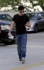 Taylor Lautner spotted walking the streets on January 9th 2010 wearing a black tshirt and sunglasses 3