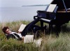 Robert Pattinson photo shoot of December 2009 issue of Vanity Fair Magazine beside a piano in an open field 1