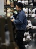 Robert Pattinson spotted getting food from Nandos restaurant as well as shopping at some local stores on February 6th 2010 in London 5