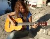 Rania Nageeb picture playing the guitar 1