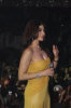 Haifa Wehbe photo while performing on stage at her 2010 valentines concert wearing a yellow dress 3