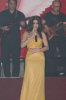 Haifa Wehbe photo while performing on stage at her 2010 valentines concert wearing a yellow dress 1