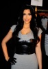 Kim Kardashian spotted at the Bebe Fall fashion show on February 16th 2010 wearing a gray short dress 2