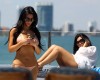 Kim Kardashian and Kourtney Kardashian spotted relaxing and sun bathing on a yakht on March 20th 2010 in Miami Florida 1