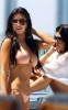 Kim Kardashian and Kourtney Kardashian spotted relaxing and sun bathing on a yakht on March 20th 2010 in Miami Florida 5