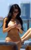 Kim Kardashian picture wearing a light pink bikini swim suit on a yakht on March 20th 2010 in Miami Florida 2