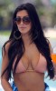 Kim Kardashian picture wearing a light pink bikini swim suit on a yakht on March 20th 2010 in Miami Florida 5