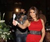 Iraqi singer Shatha Hassoun photo from her own birthday party wearing a stylish dark red dress 7