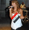 Iraqi singer Shatha Hassoun photo with Iraq Flag while singing