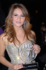 Iraqi singer Shatha Hassoun photo with an award