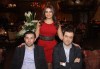 Iraqi singer Shatha Hassoun photo from her own birthday party wearing a stylish dark red dress 2