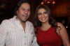 Iraqi singer Shatha Hassoun photo from her own birthday party wearing a stylish dark red dress 4