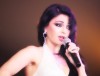 haifa Wehbe photo while singing on stage during her USA tour concert in March 2010 wearing a double white and black dress 5