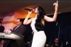 haifa Wehbe photo while singing on stage during her USA tour concert in March 2010 wearing a double white and black dress 1